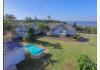 Luxury Modern Beach House with 3 Airbnb Cottages: Aerial view back garden